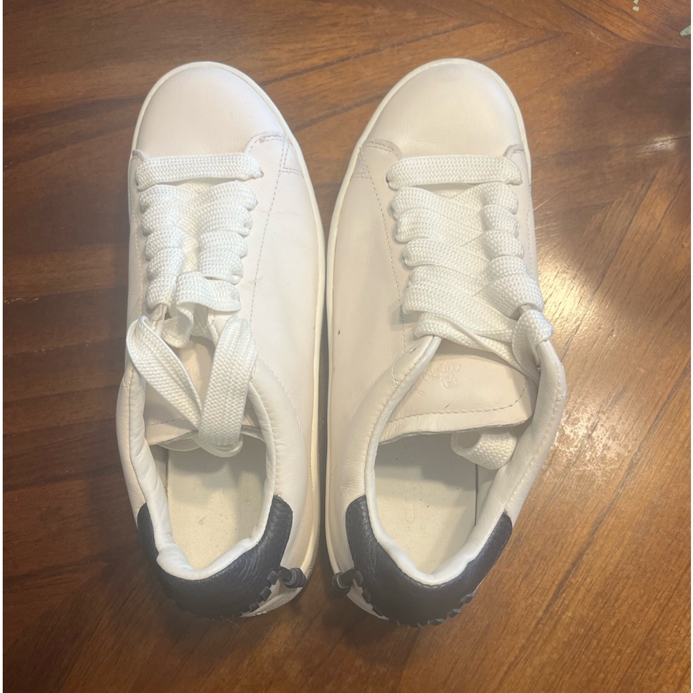 White with navy detailing Coach sneakers.  Worn once.